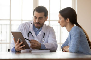 A doctor speaks with a patient.