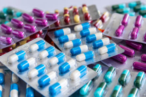 Packages of antibiotics. There are several colors and types of pills.